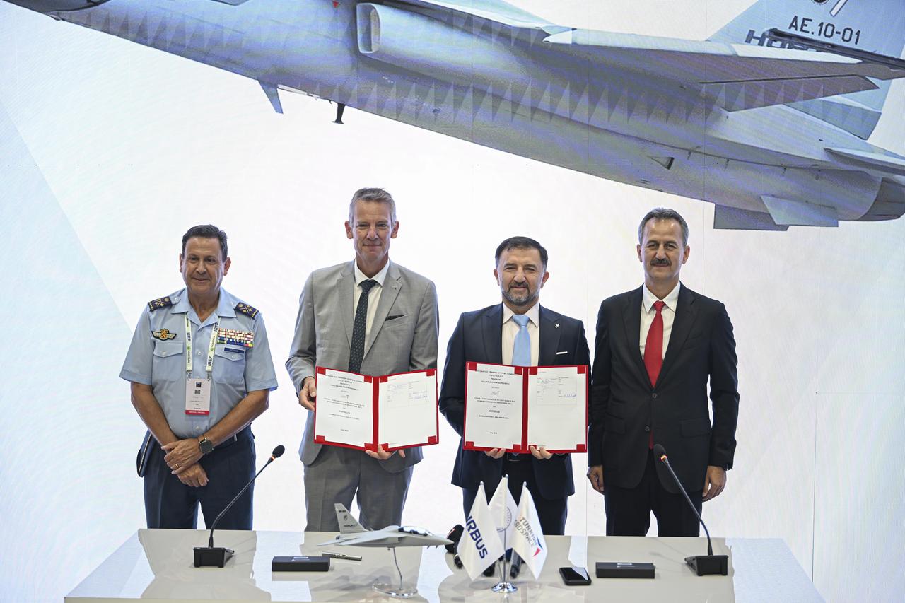 Haluk Gorgun, President of the Presidency Defense Industry (R), and Mehmet Demiroglu, General Manager of TAI (2nd from R) during signing ceremony in Istanbul, Türkiye on 24 July, 2025. (AA Photo)