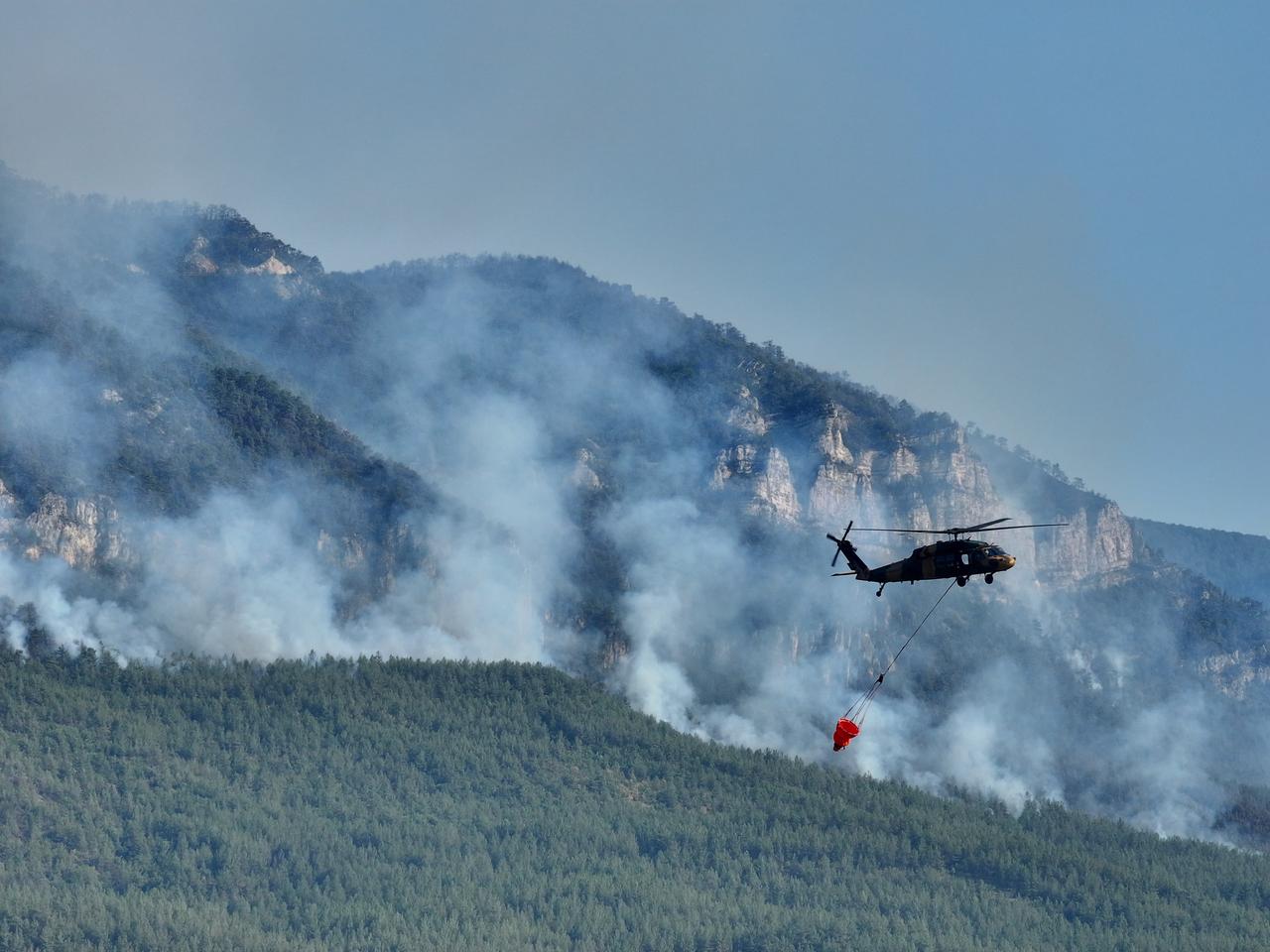 Aerial view shows firefighting efforts continue as crews are battling the flames both by air and land for the fifth day in the forested area of Safranbolu district of Karabuk, Türkiye, July 27, 2025. (AA Photo)