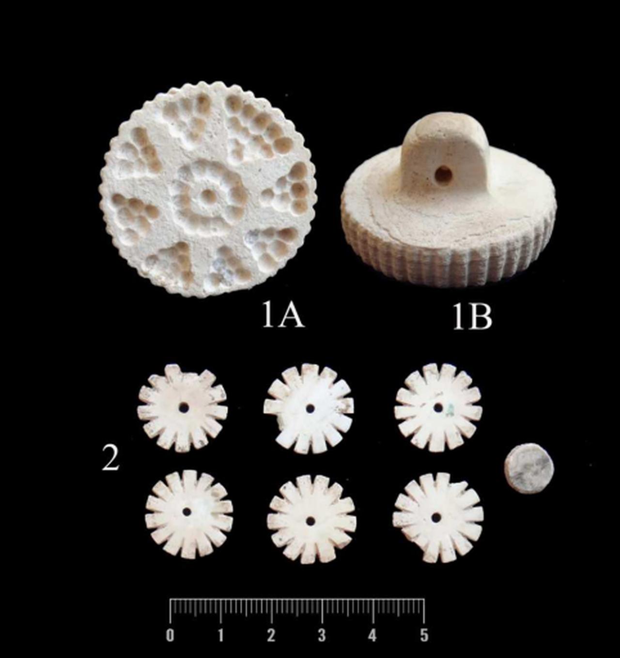 Limestone stamp seal and decorative beads of white marble from Grave 12. (Photo via Ali A. Vahdati)