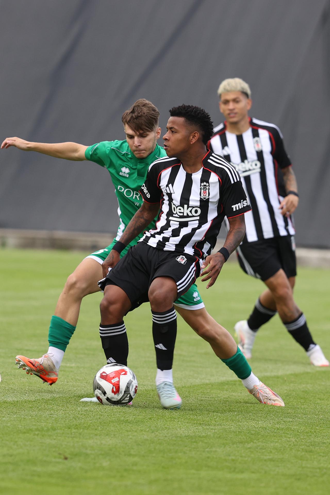 Keny Arroyo (R) of Besiktas in action against Nikolaos Deligiannis (L) of Petrzalka 1898 during the pre-season friendly match at the Ergo Arena as the Besiktas continues preparations for the new season in Wiener Neustadt, Austria, July 17, 2025. (AA Photo)
