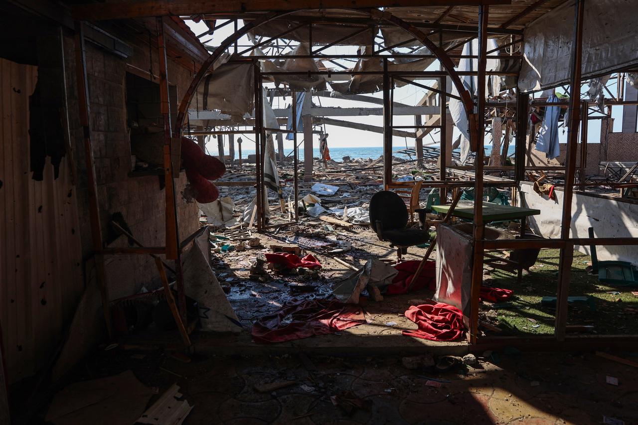 A Palestinian man inspect the damage at Al-Baqa cafeteria which was devastated in an Israeli strike on the Gaza City seafront on June 30, 2025. (AFP Photo)