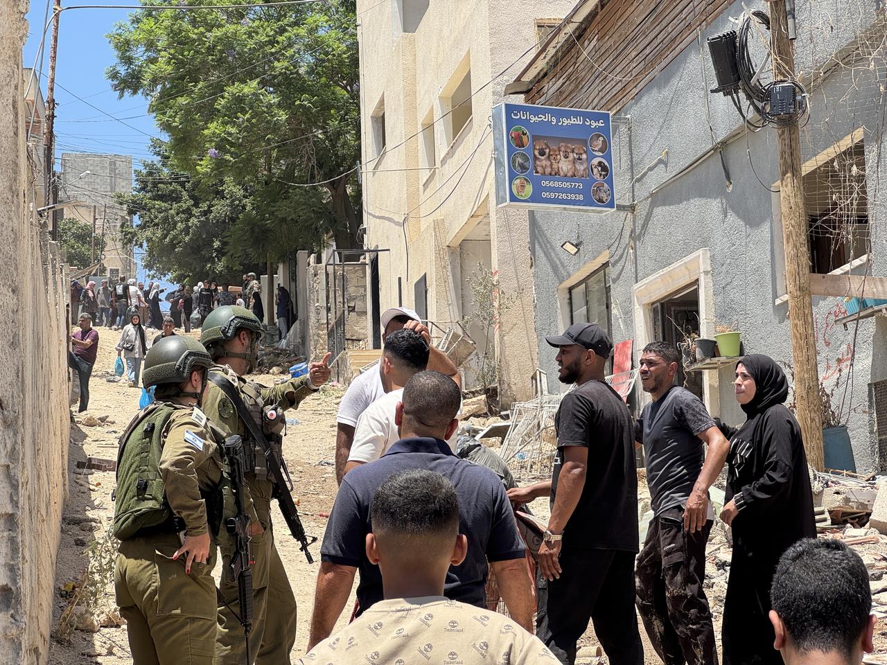 Palestinians carry their belongings as they are forced to leave their homes after Israel issues demolition orders for 104 buildings in Tulkarm, West Bank on July 03, 2025. (AA Photo)