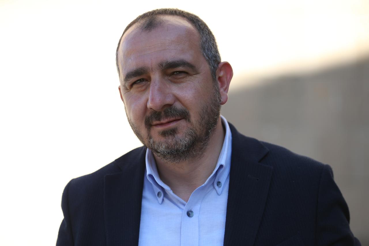 Associate Professor Muhammet Arslan, director of Ani excavations, July 3, 2025. (AA Photo)