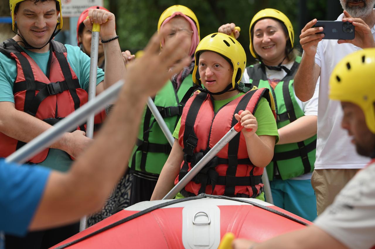 People with special needs take part in rafting tours as part of “Happiness Boat" project organized on certain days of the year by rafting companies in Duzce, Türkiye, July 1, 2025. (AA Photo)