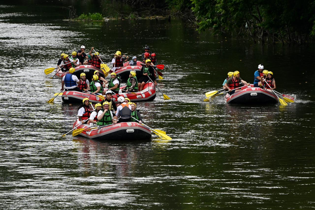 People with special needs take part in rafting tours as part of “Happiness Boat" project organized on certain days of the year by rafting companies in Duzce, Türkiye, July 1, 2025. (AA Photo)