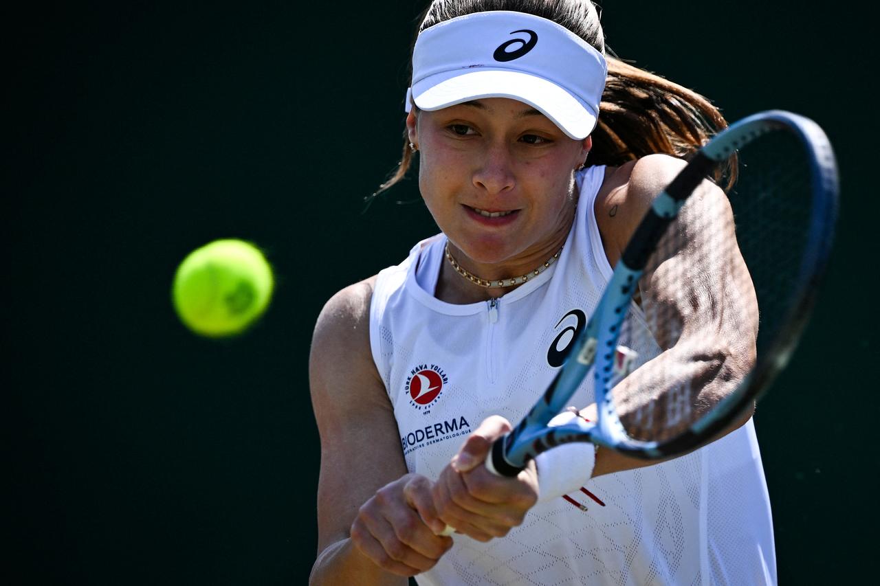 Zeynep Sonmez plays a backhand return to China's Wang Xinyu during their women's singles second round tennis match on the fourth day of the 2025 Wimbledon Championships at The All England Lawn Tennis and Croquet Club in Wimbledon, southwest London, July 3, 2025. (AFP Photo)