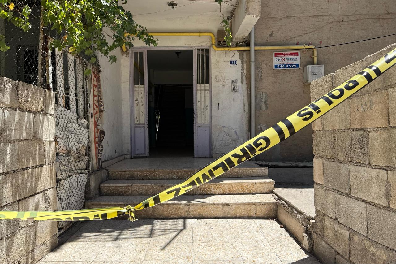 Police tape reading  do not enter  blocks house scene of family tragedy, Gaziantep, Türkiye, July 3, 2025. (IHA Photo)