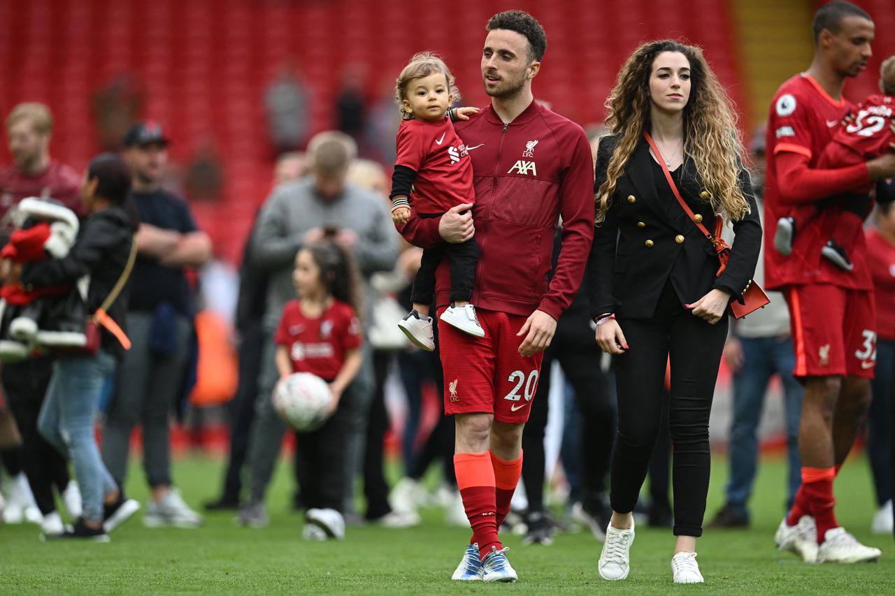 Liverpool's Portuguese striker Diogo Jota celebrates his family during a lap of honour at the end of the English Premier League football match between Liverpool and Wolverhampton Wanderers at Anfield in Liverpool, north west England on May 22, 2022. (AFP Photo)