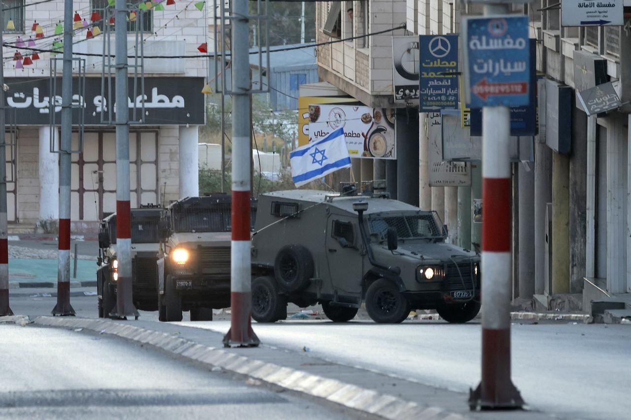 Israeli army forces deploy around the religious site of Joseph's Tomb in the occupied West Bank city of Nablus on June 27, 2025. (AFP Photo)