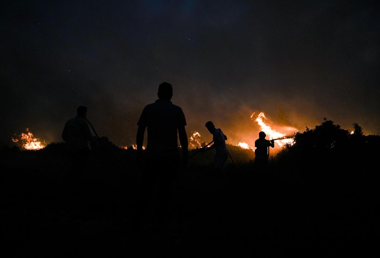 Ground crews continued efforts, with local residents also joining the firefighting efforts,Türkiye, Cesme, on July ,2,2025.(Photo via AA)