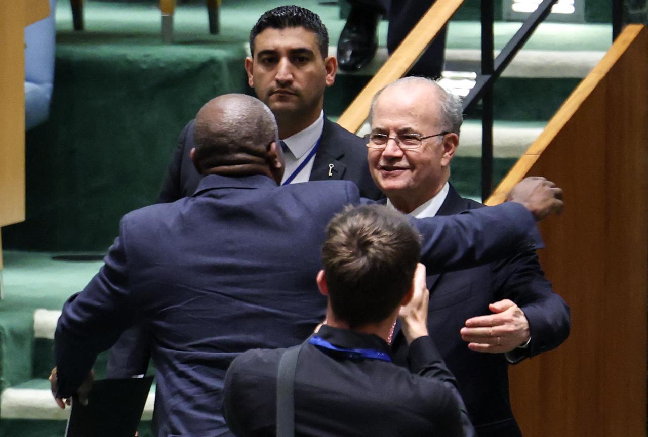 British Foreign Secretary David Lammy embraces Palestinian Prime Minister Mohammad Mustafa (R) after Lammy spoke during a United Nations conference on a two state solution for Israel and the Palestinians, at UN headquarters in New York City, on July 29, 2025. (Photo by AFP)