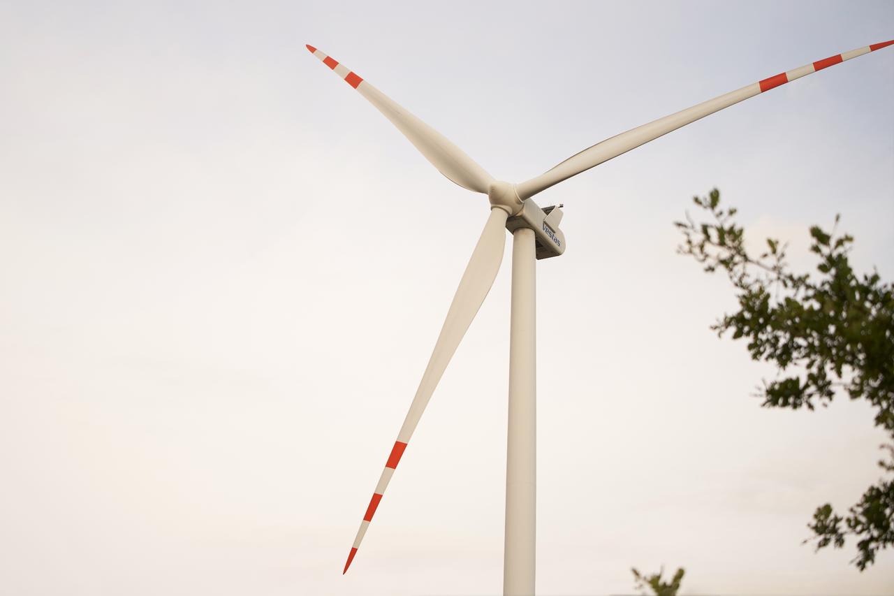 Wind turbine against blue sky in Poland on 18 August, 2023. (Adobe Stock Photo)