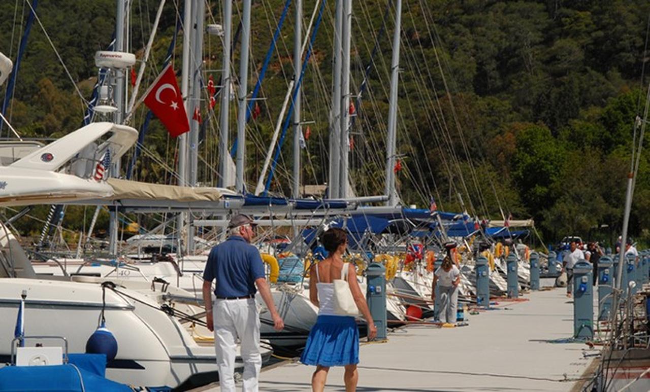 Visitors walk along the dock at a marina in Gocek, Mugla, Türkiye. (Photo via marinturk.com.tr)