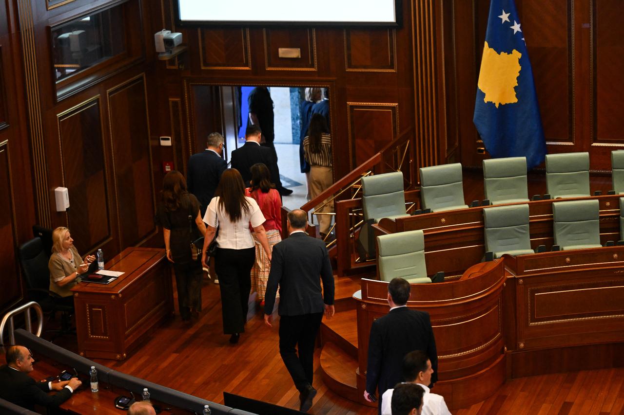 Lawmakers exit the plenary chamber of Kosovo’s Parliament during a session held in Pristina, July 13, 2025. (AFP Photo)