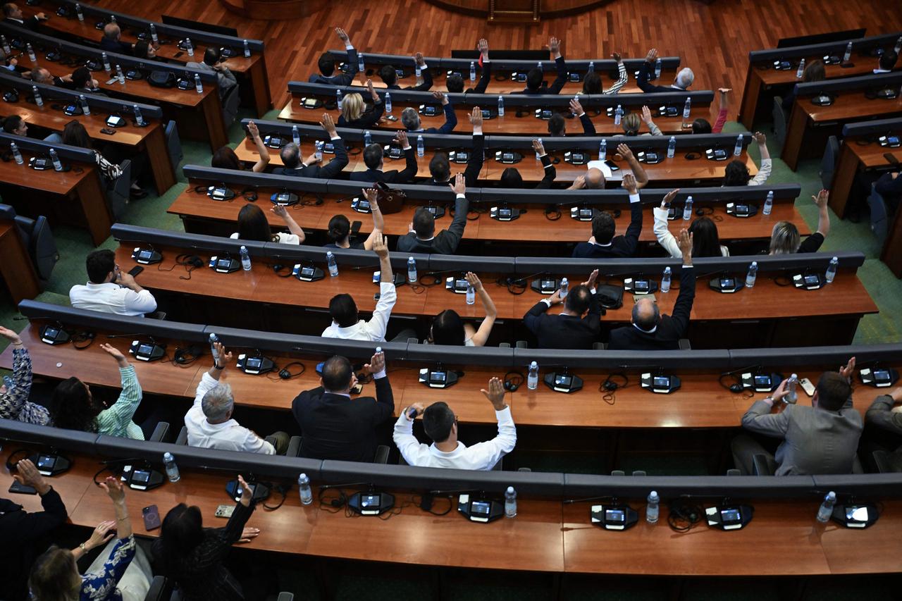 Lawmakers in Kosovo’s Assembly participate in a voting session inside the plenary hall in Pristina, July 13, 2025.  (AFP Photo)