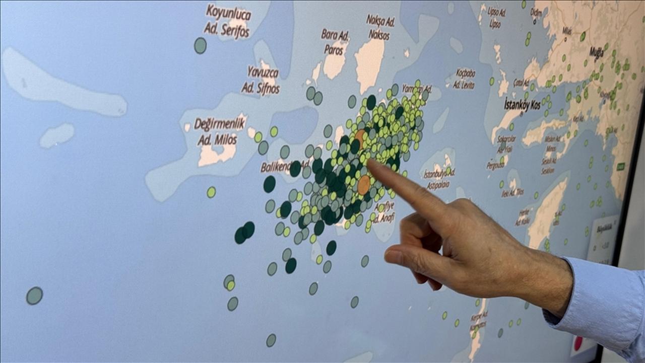 A scientist points to the Santorini area on a map showing earthquake activity from January 28, 2025. (AA Photo)