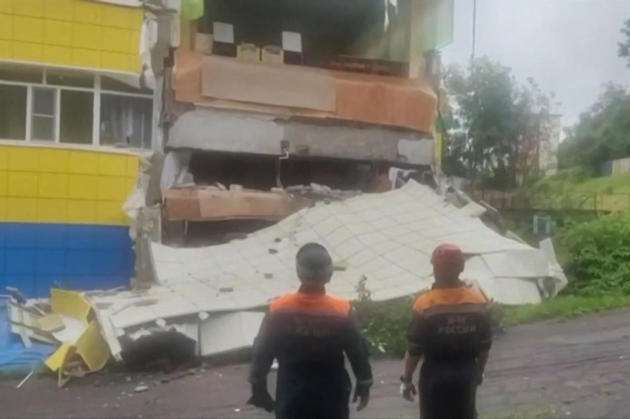 This frame grab taken from video released by the Russian Ministry of Emergency Situations taken and released on July 30, 2025 shows rescuers inspecting a damaged kindergarten building in Russia's Kamchatka region. (Russian Ministry of Emergency Situations/AFP Photo)