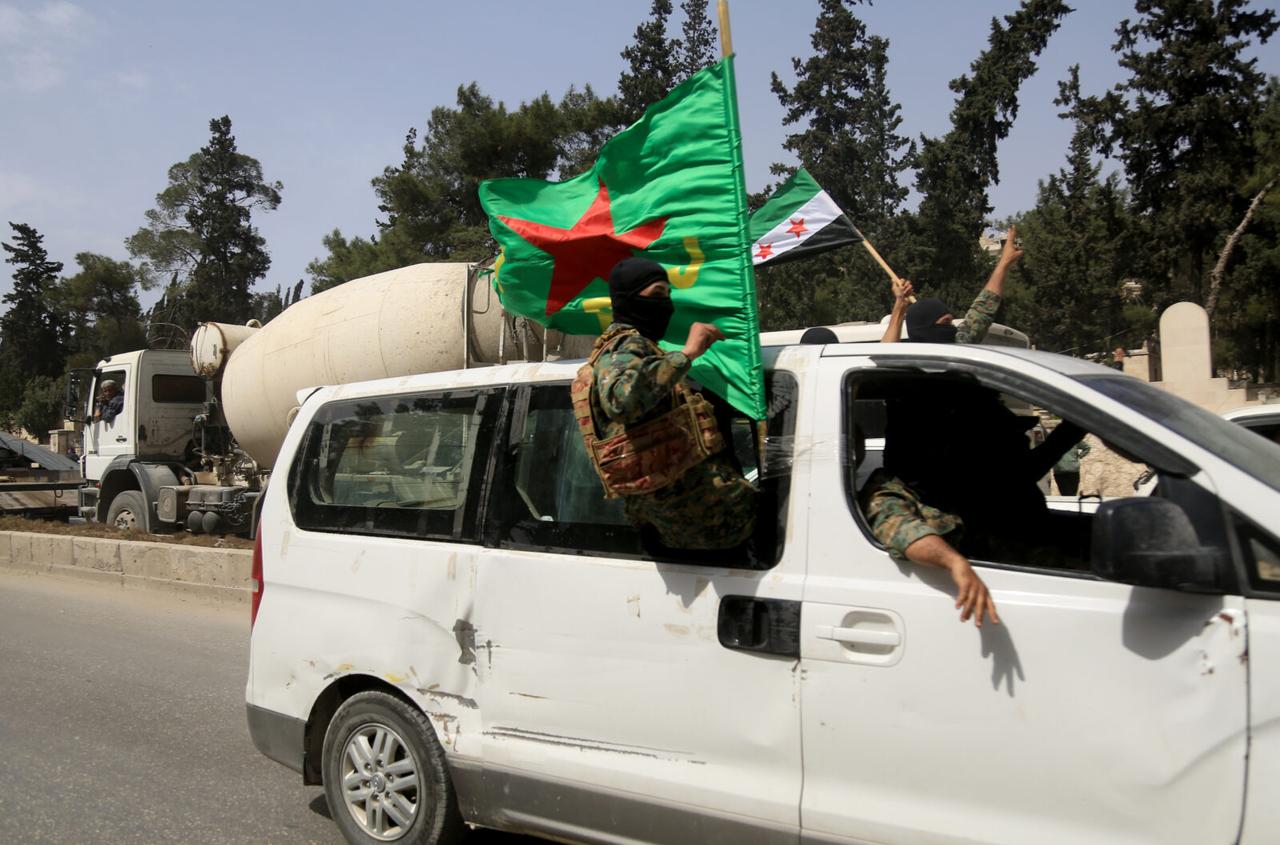 A convoy carrying PKK/YPG terrorists who had occupied the Sheikh Maksoud and Ashrafiyeh neighborhoods in Aleppo, departs city on April 9, 2025. (AA Photo)