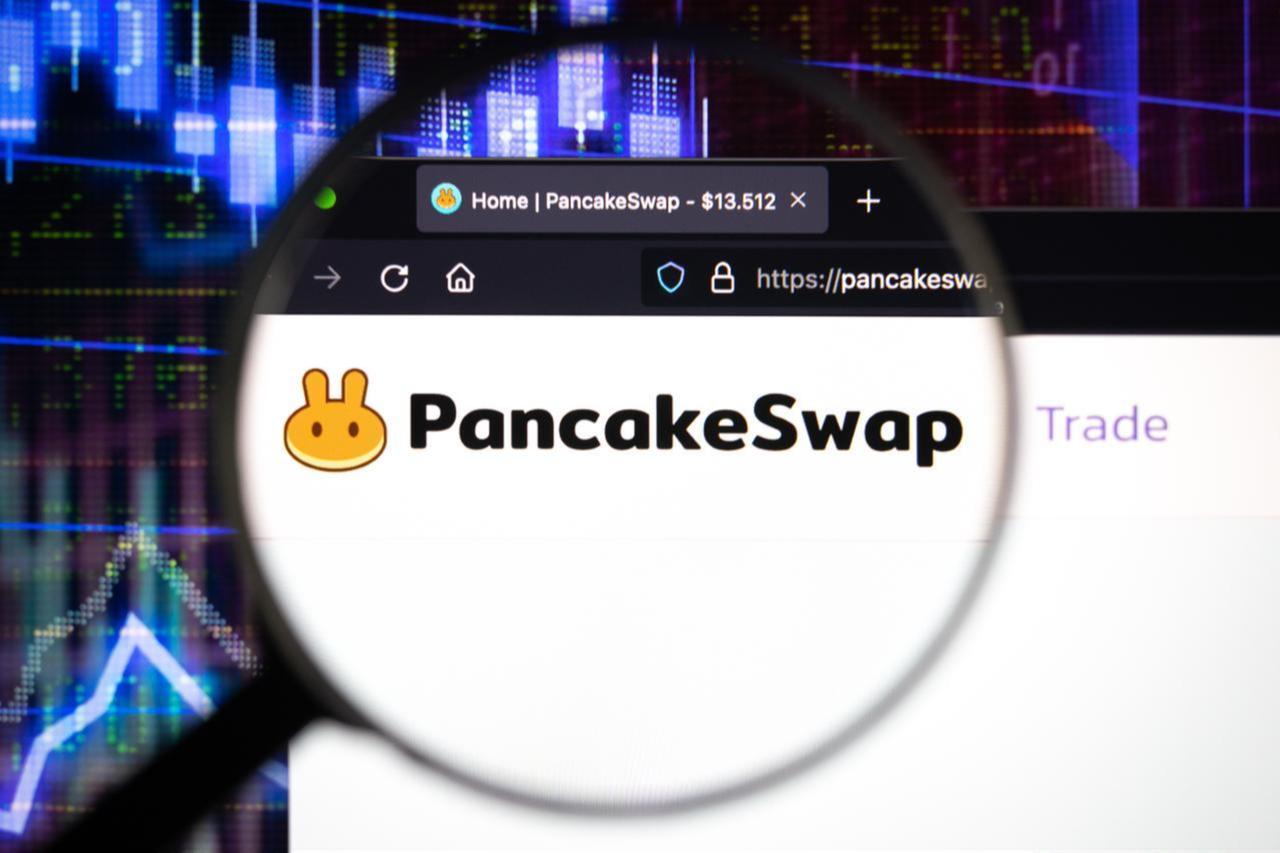 A magnifying glass hovers over the PancakeSwap logo on a website, accessed on July 4, 2025. (Adobe Stock Photo)