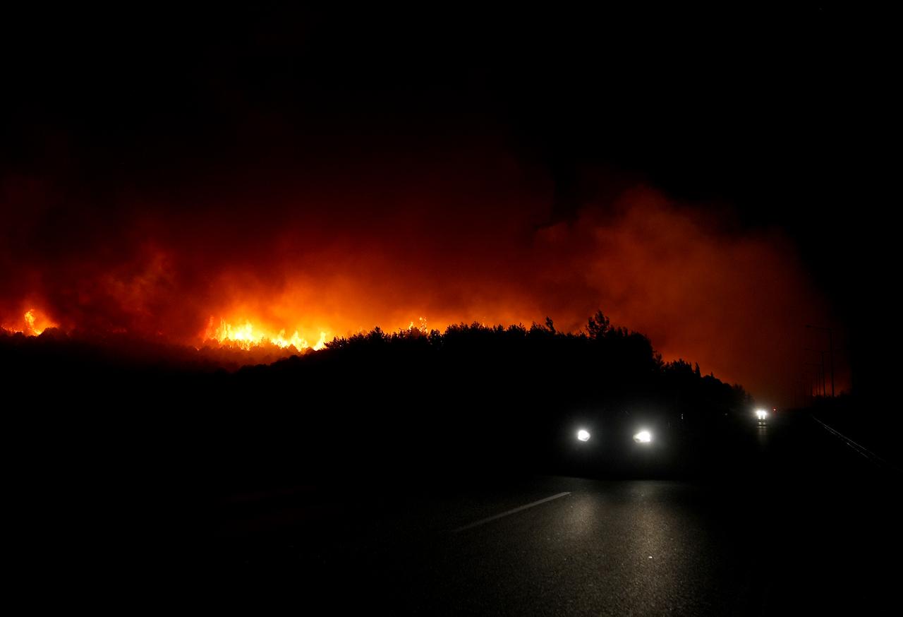 Smoke rises from burning trees while air and land intervention continues against the fire that broke out in the forest area in Buca district of Izmir, Türkiye on July 03, 2025. (AA Photo)