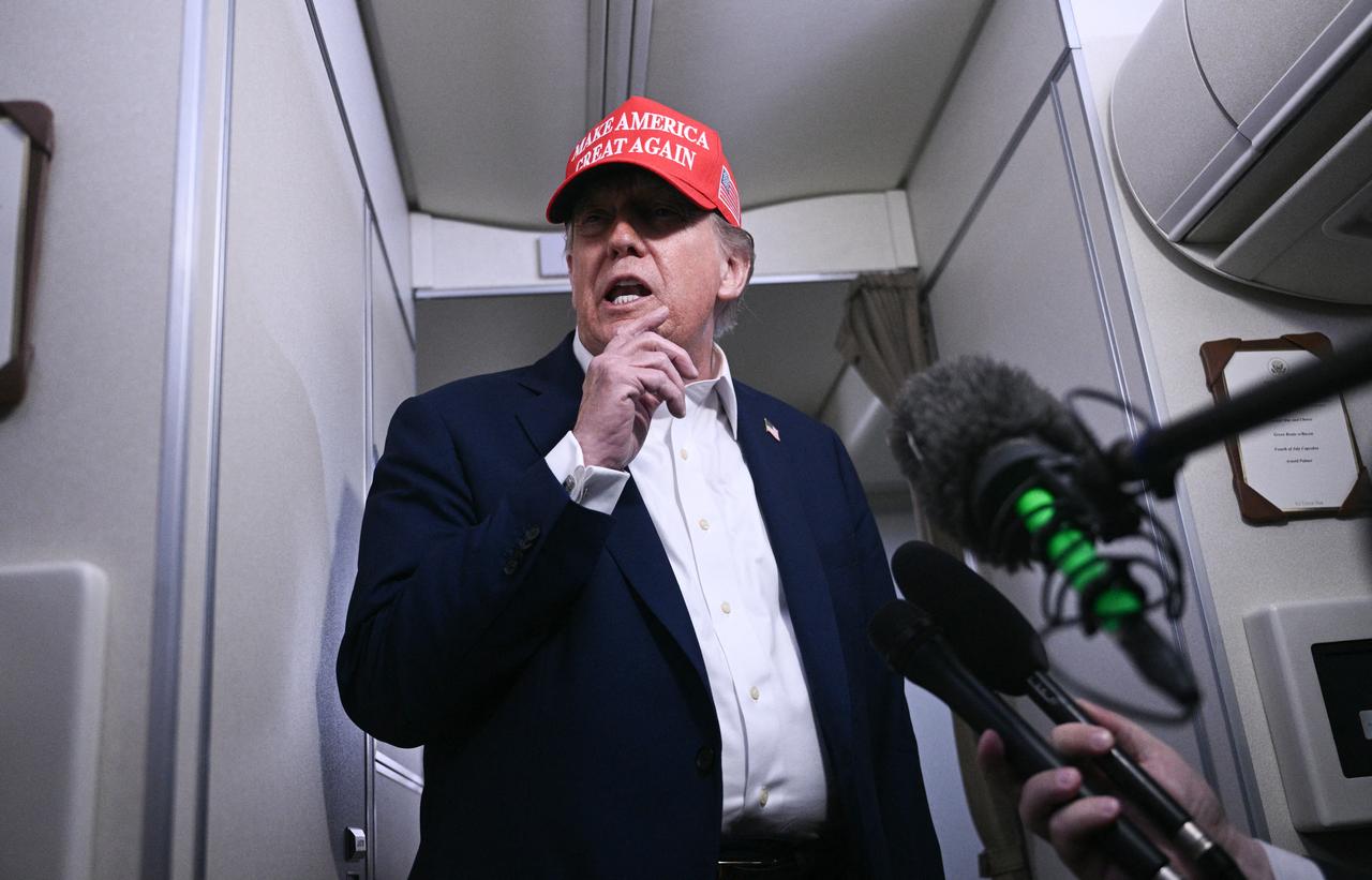 US President Donald Trump speaks to journalists aboard Air Force One after departing Joint Base Andrews, Maryland on his way to Bedminster, New Jersey on July 4, 2025. (AFP Photo)