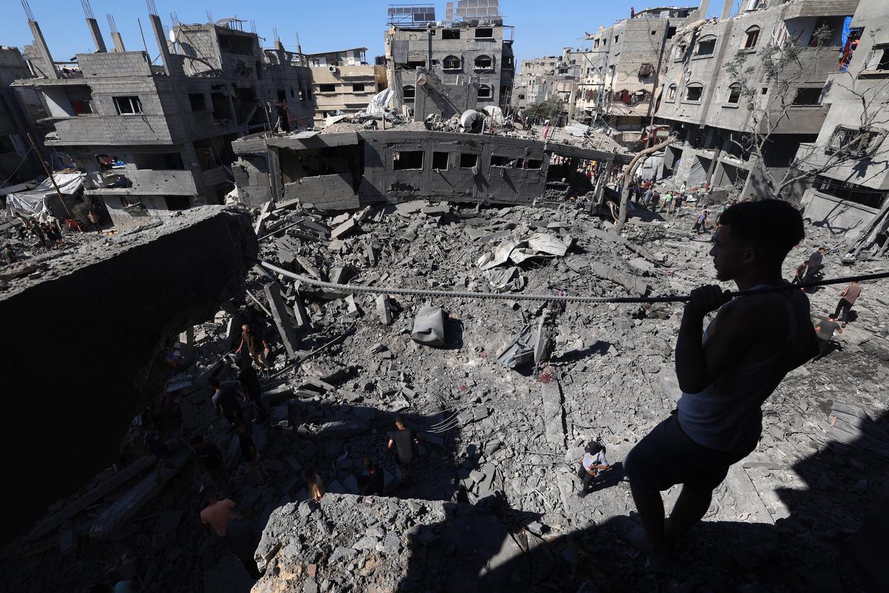 A Palestinian man inspects the damage after an Israeli strike in the Al-Bureij camp in the central Gaza Strip on July 4, 2025. (AFP Photo)