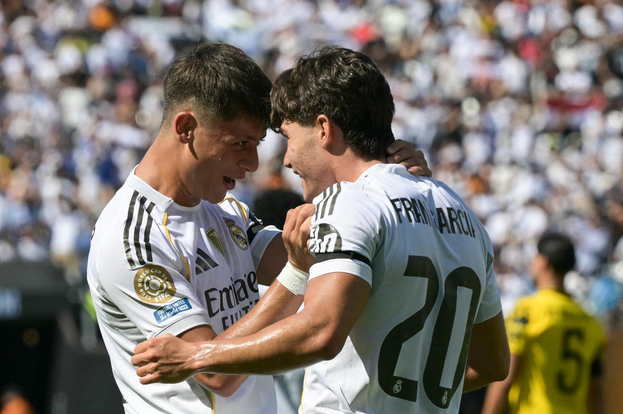 Real Madrid's Spanish defender #20 Francisco Garcia (R) celebrates with teammate Turkish midfielder #15 Arda Guler (L) after scoring his team's second goal during the FIFA Club World Cup 2025 quarterfinal football match between Spain's Real Madrid and Germany's Borussia Dortmund at the MetLife stadium in East Rutherford, New Jersey on July 5, 2025. (AFP Photo)