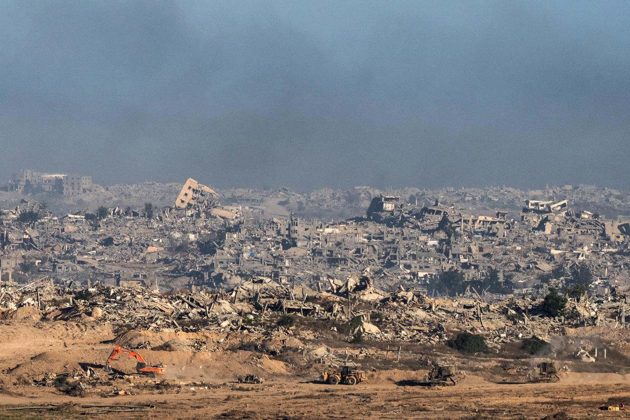 This picture taken from a position near Israel's border with the Gaza Strip, shows Israeli bulldozers and vehicles inside the the besieged territory on July 6, 2025. (AFP Photo)