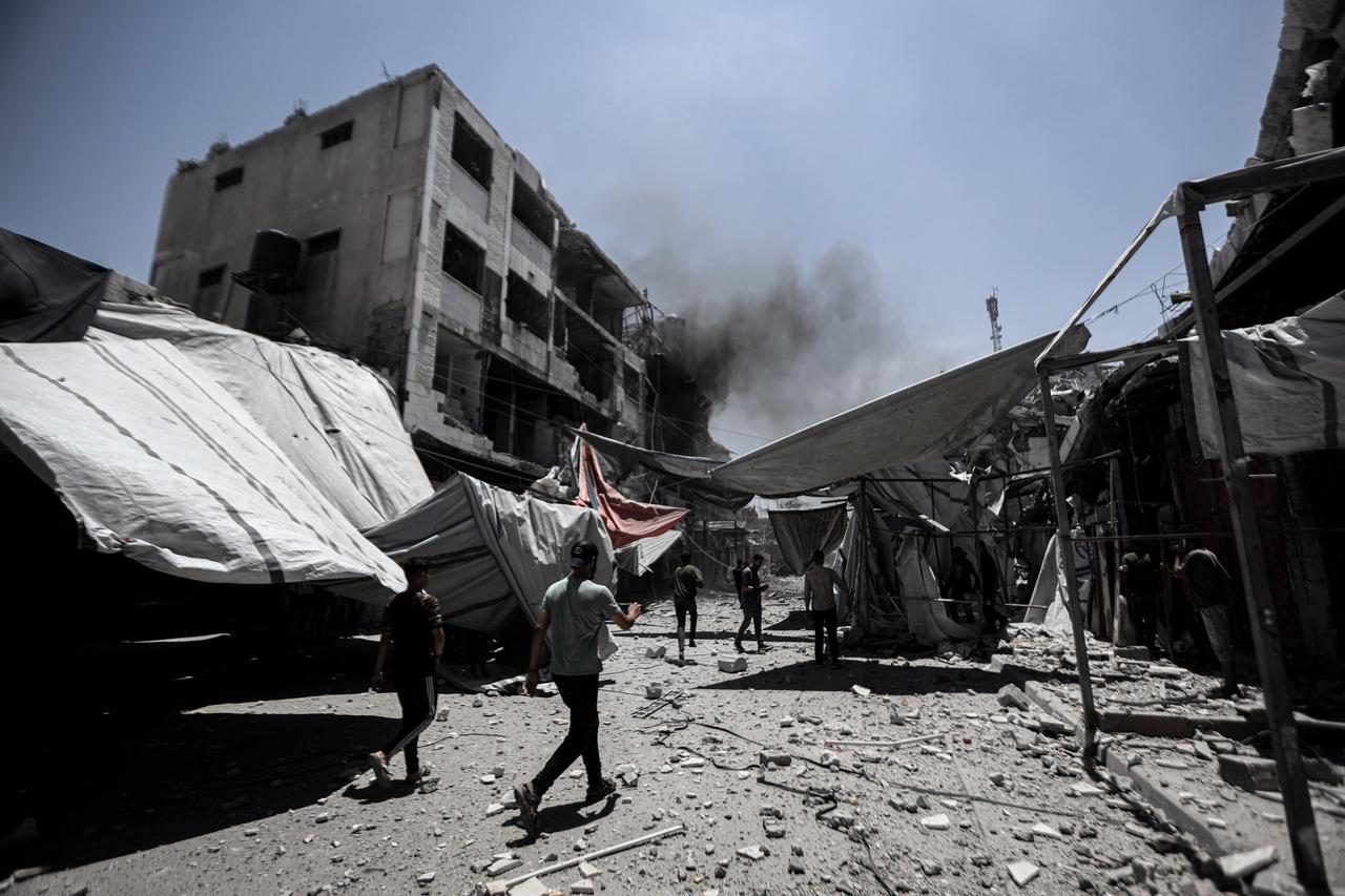A view of the scene where a large fire broke out following Israeli army strikes on a previously warned apartment building on Omar Mukhtar Street in Gaza City, Gaza and a commercial building in the nearby Omar Mukhtar Market to the east, on July 6, 2025. (AA Photo)