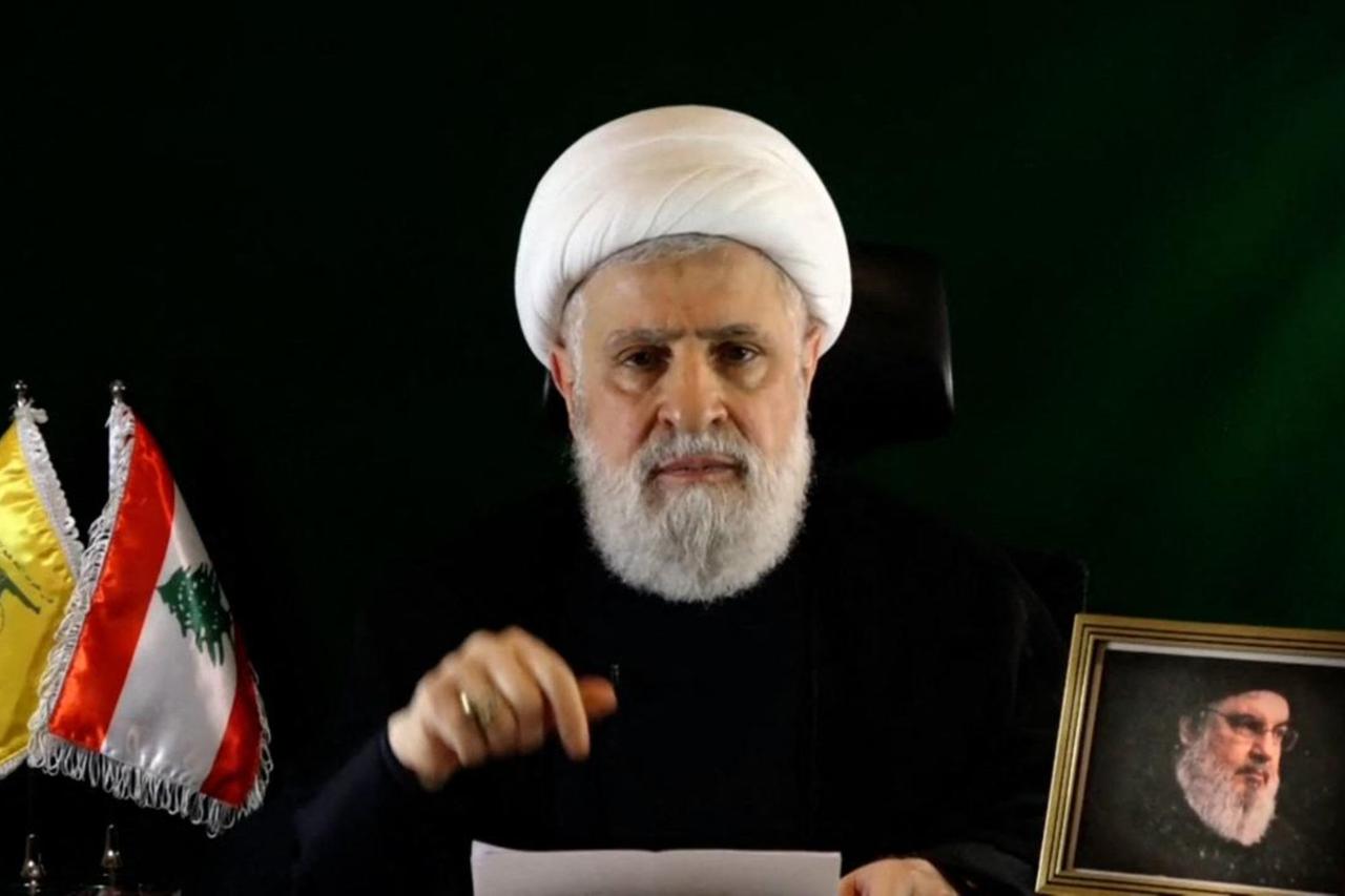 An image grab taken from Hezbollahs Al-Manar TV shows the groups deputy chief Naim Qassem delivering a speech from an undisclosed location on October 15, 2024. (AFP Photo)
