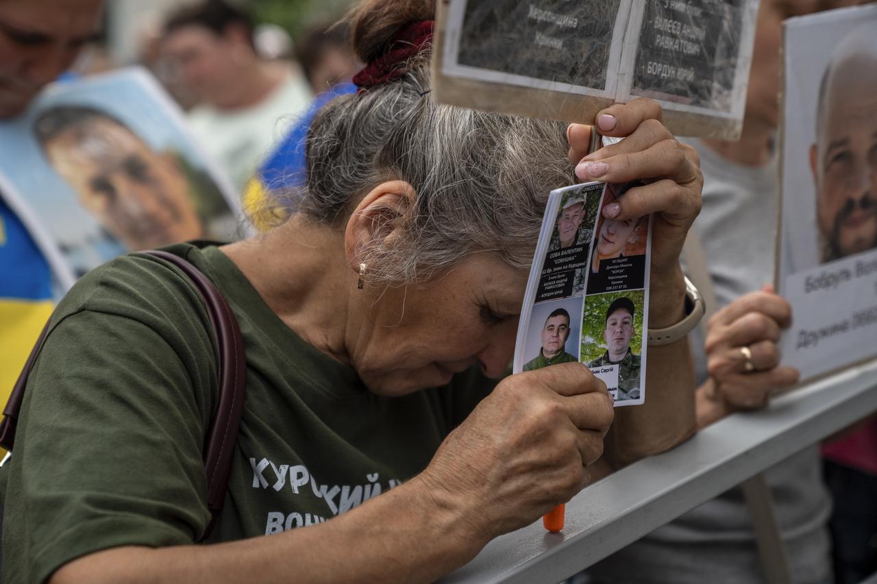 Relatives and loved ones of Ukrainian military personnel of the Armed Forces, the National Guard, the State Border Guard Service and the State Special Transport Service wait for them to return after the prisoner swap deal in Chernihiv region of Ukraine, on July 04, 2025. (AA Photo)