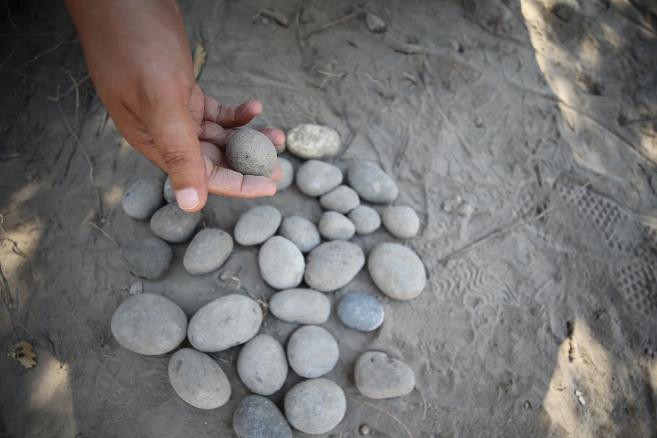 Sling stones dating back 3,500 years unearthed in front of the palace structure during archaeological excavations at the ancient city of Troy in Canakkale, Türkiye, July 7, 2025. (AA Photo)