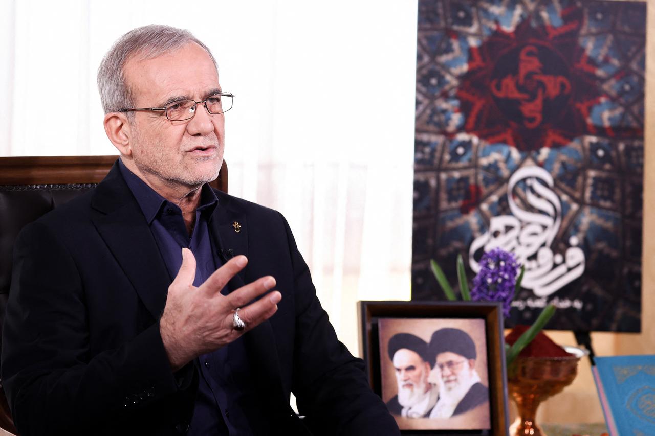 This handout picture provided by the media office of the Iranian presidency shows the Iranian President Masoud Pezeshkian during the annual address to the nation for Nowruz, the Persian New Year, in Tehran on March 20, 2025. (Iranian Presidency / AFP Photo)