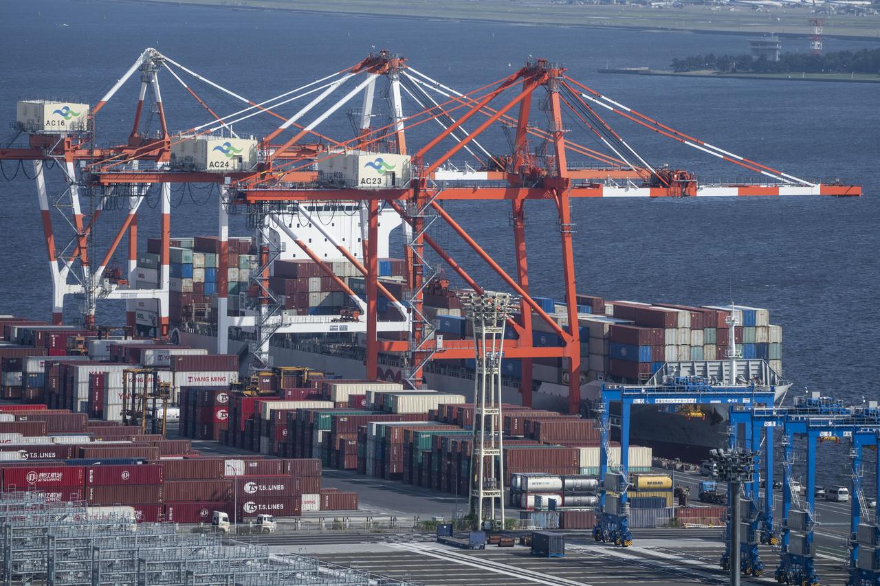 Shipping containers and a container ship are seen at the international cargo terminal in Tokyo, Japan on July 4, 2025. (AFP Photo)