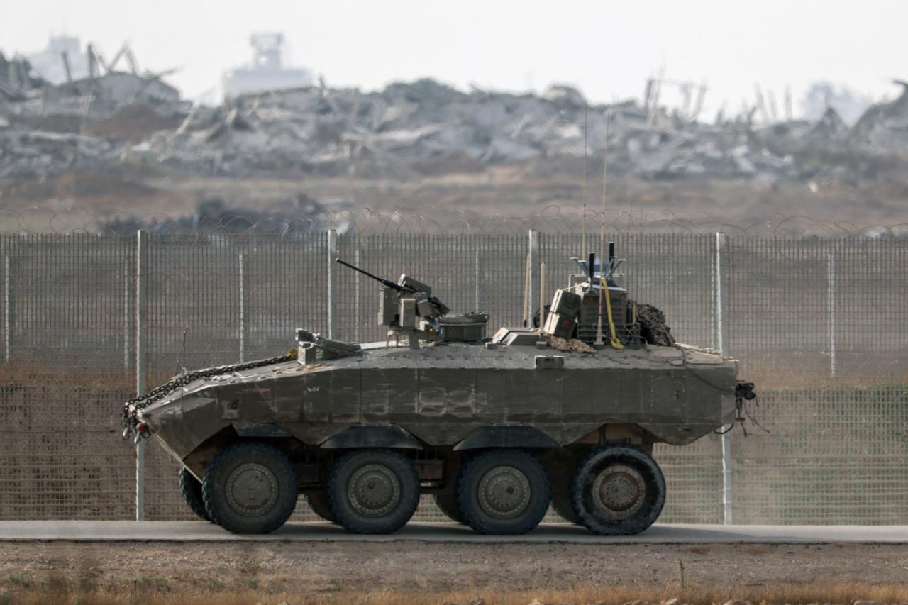 Israeli troops deploy by Israel's border fence with the Gaza Strip on July 1, 2025. (AFP Photo)