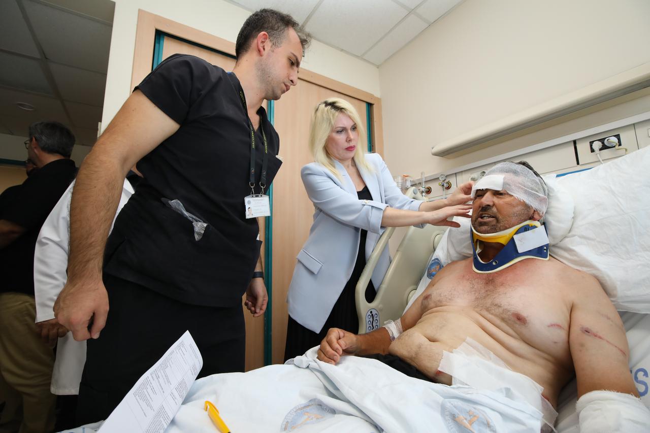 Prof. Dr. Ozlenen Ozkan (C), Rector of Akdeniz University, and Prof. Dr. Yildiray Cete, Chief Physician of Akdeniz University Hospital, visited Suleyman Kir (R) and spoke with him for a while, Antalya, Türkiye, July 7, 2025. (AA Photo)