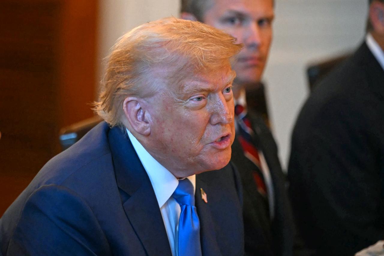 US President Donald Trump meets with unseen Israeli Prime Minister Benjamin Netanyahu at the Blue Room of the White House in Washington, DC, on July 7, 2025. (AFP Photo)