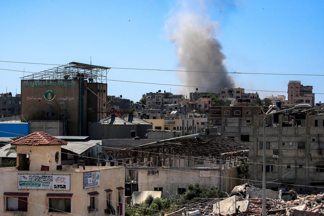 A smoke plume billows from a building that was hit by Israeli bombardment in the Nuseirat camp for Palestinian refugees in the central Gaza Strip on July 6, 2025. (AFP Photo)