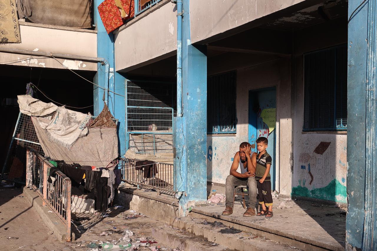 A Palestinian man reacts as he looks at the destruction after an Israeli strike hit a school sheltering displaced Palestinians in the Al-Bureij camp in the central Gaza Strip on July 8, 2025. (AFP Photo)