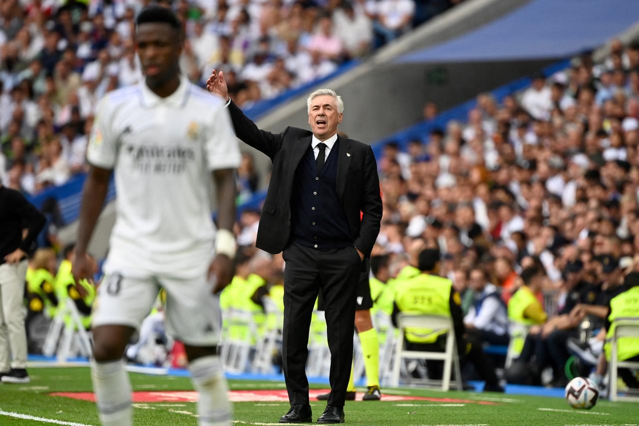 Real Madrid's Italian coach Carlo Ancelotti gestures during the Spanish League football match between Real Madrid CF and FC Barcelona at the Santiago Bernabeu stadium in Madrid on October 16, 2022. (AFP Photo)