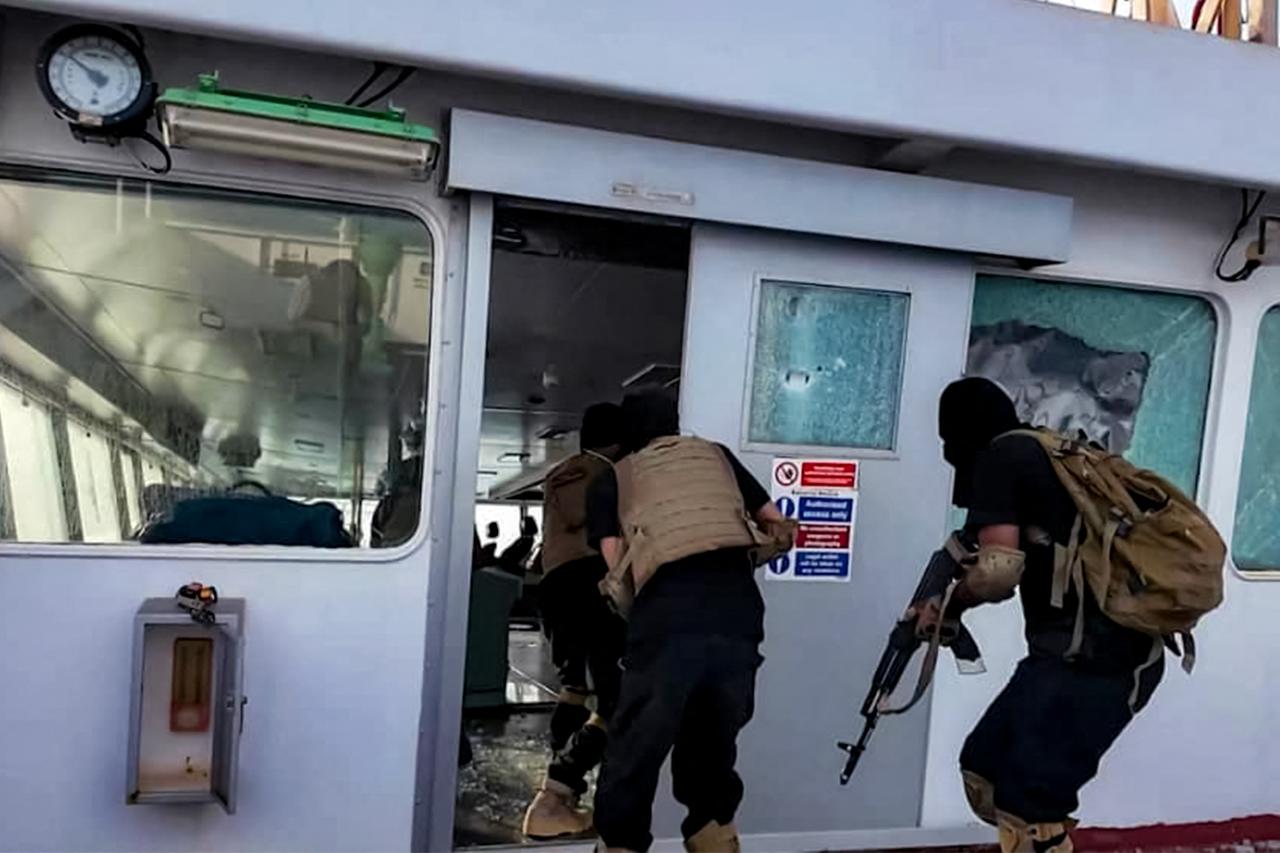 This handout image released by Yemen’s Huthi Ansarullah Media Centre shows Huthi-affiliated fighters storming the Liberian-flagged bulk carrier Magic Seas in the Red Sea on July 8, 2025. (AFP Photo)