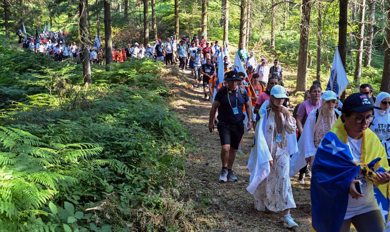 Participants waved flags as they began the annual 100-kilometre "Peace March" from the village of Nezuk in eastern Bosnia. The march is held to honor the victims of the 1995 Srebrenica massacre, ahead of its 30th anniversary, on July 8, 2025. (AFP Photo)