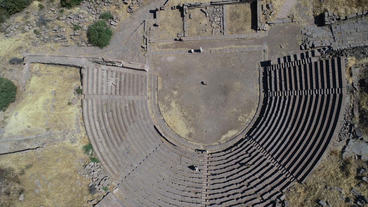 An aerial view of the 2,200-year-old theater in the ancient city of Assos, located within the borders of Behramkale village in Ayvacik district of Canakkale, Türkiye, July 31, 2025. (AA Photo)