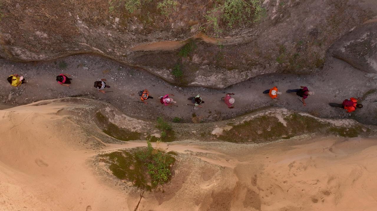 Travelers hike through Avla Canyon in Yesilhisar district of Kayseri, Türkiye, July 31, 2025. (AA Photo)