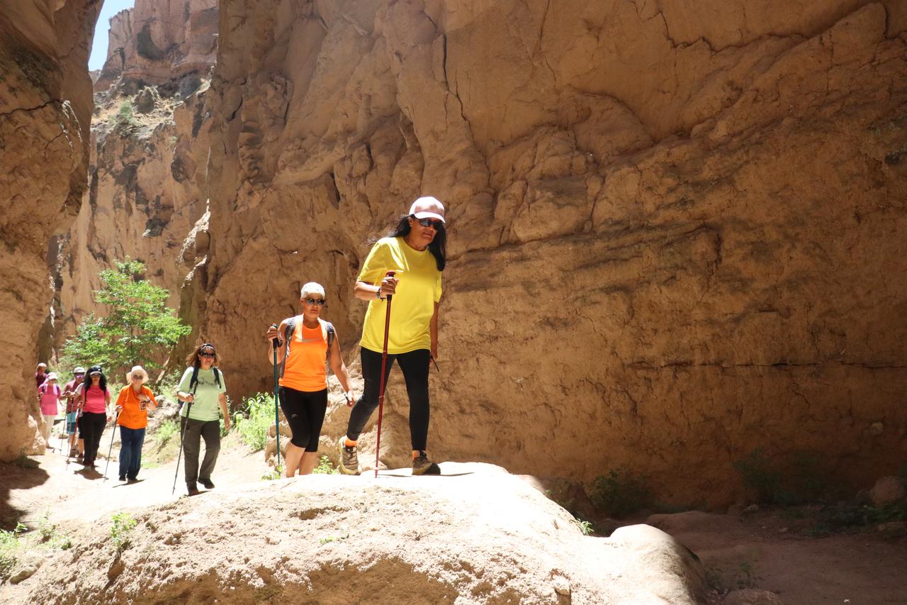 Travelers hike through Avla Canyon in Yesilhisar district of Kayseri, Türkiye, July 31, 2025. (AA Photo)