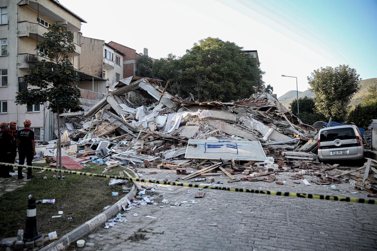 A view shows the destruction of a building and a car as search and rescue efforts continue at a collapsed three-story building after the 6.1-magnitude earthquake in the Sindirgi district of Balikesir, Türkiye, August 11, 2025. (AA Photo)