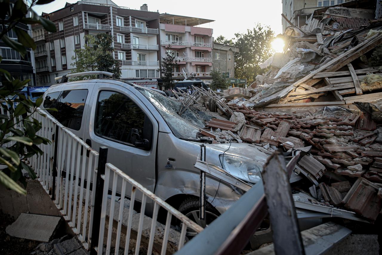 A view shows destroyed buildings and a car as search and rescue efforts continue at a collapsed three-story building after the 6.1-magnitude earthquake in the Sindirgi district of Balikesir, Türkiye, August 11, 2025. (AA Photo)