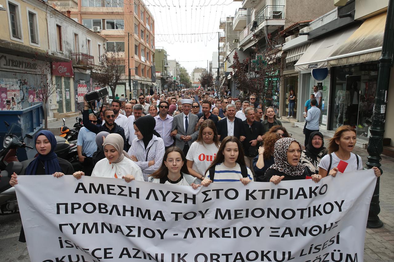 Turks from Western Thrace hold  red cards  and banners in Xanthi, Greece on September 25, 2023. (AA Photo)