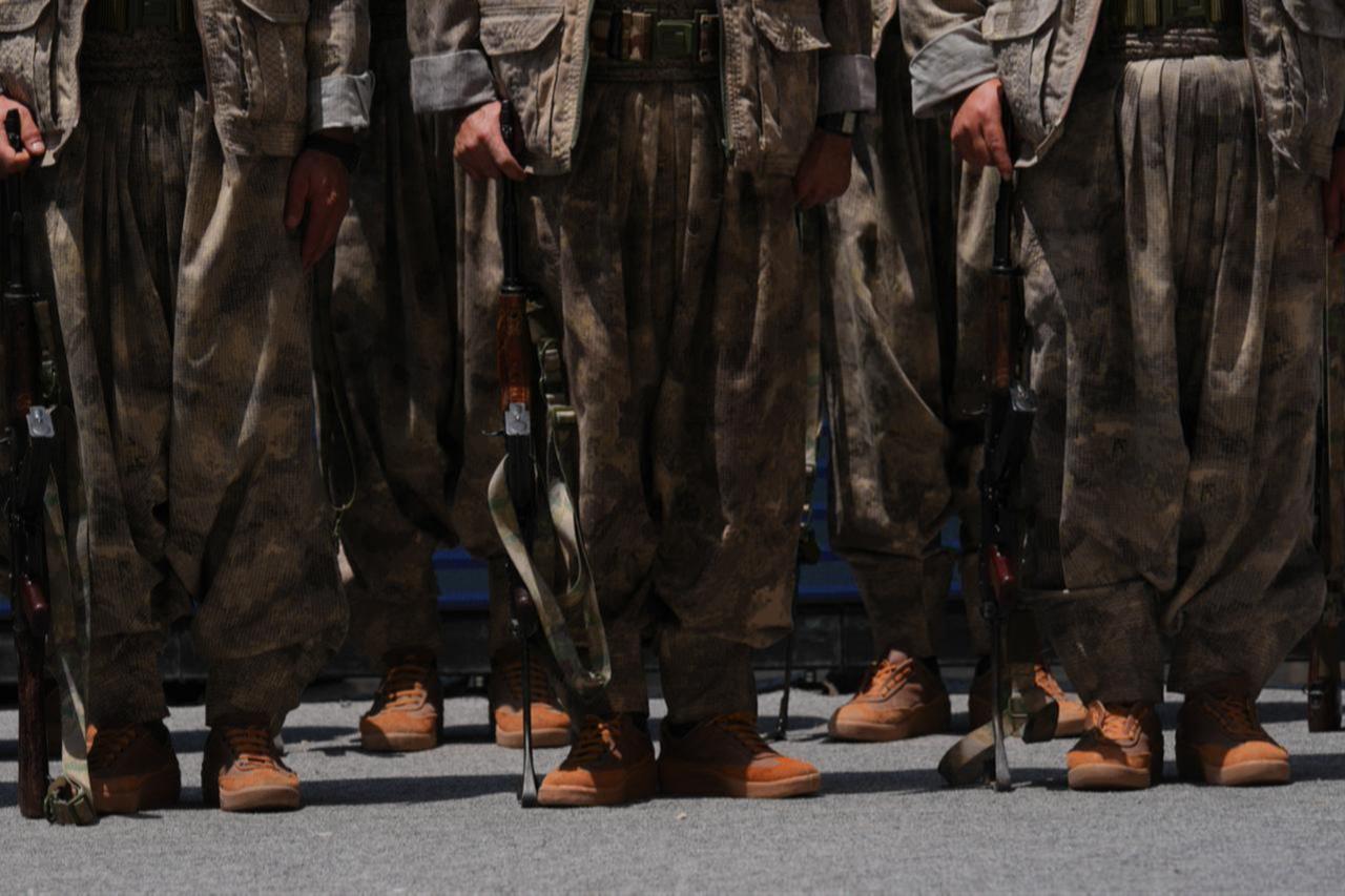 The first group of PKK terrorists lays down and destroys their weapons in Sulaymaniyah, northern Iraq on July 11, 2025. (AFP Photo)