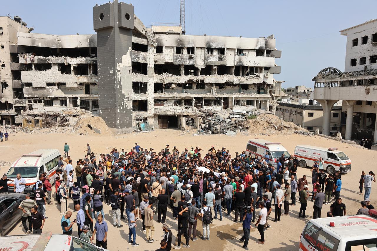 Mourners carry bodies of Palestinians, including journalists and a medic, killed in an overnight Israeli strike outside the Al-Shifa Hospital in Gaza City on August 11, 2025. (AFP Photo)